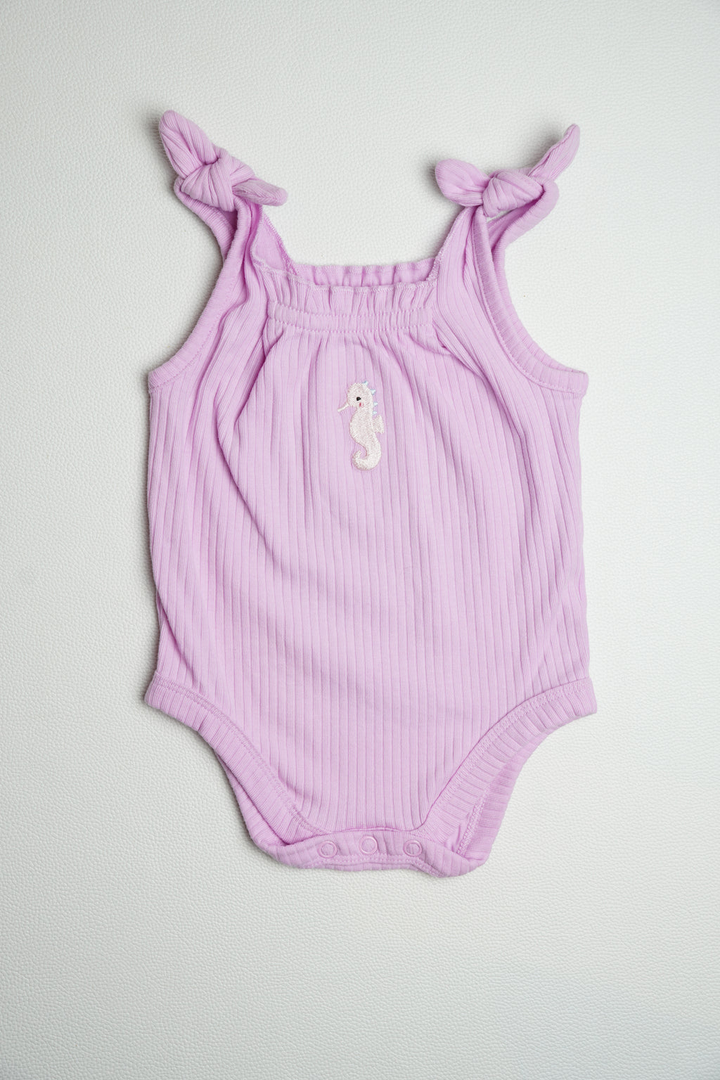 PURPLE SEA HORSE | ONESIE